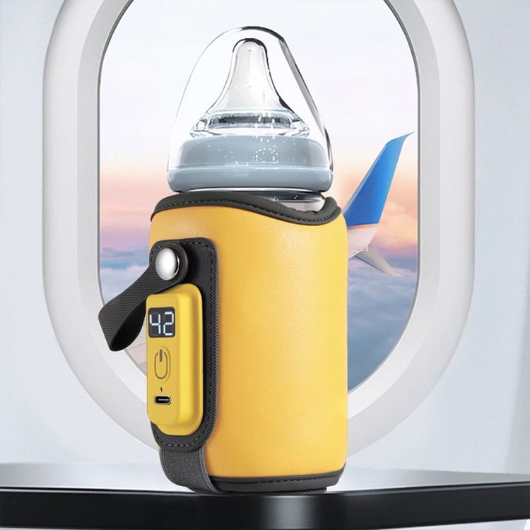 Chauffe biberon portable idéal pour nourrir bébé lors d’un voyage en avion