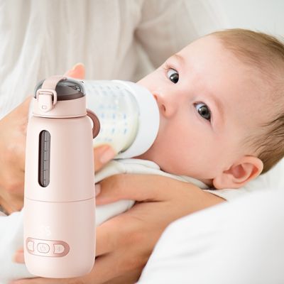 Chauffe biberon nomade portable rose modèle pratique avec alimentation usb et plusieurs niveaux de température
