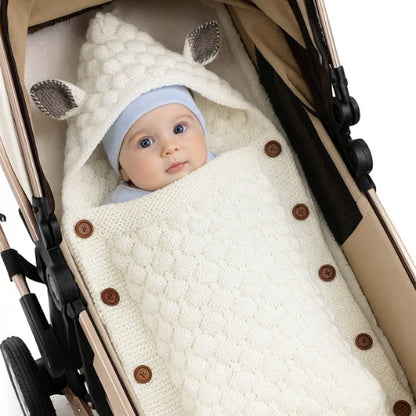 Nid d'ange cosy tricoté blanc unisexe offrant chaleur et confort pour bébé
