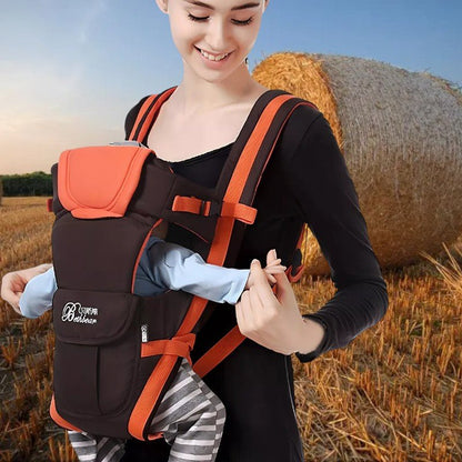 Porte bébé physiologique orange offrant sécurité, confort et maintien pour bébé