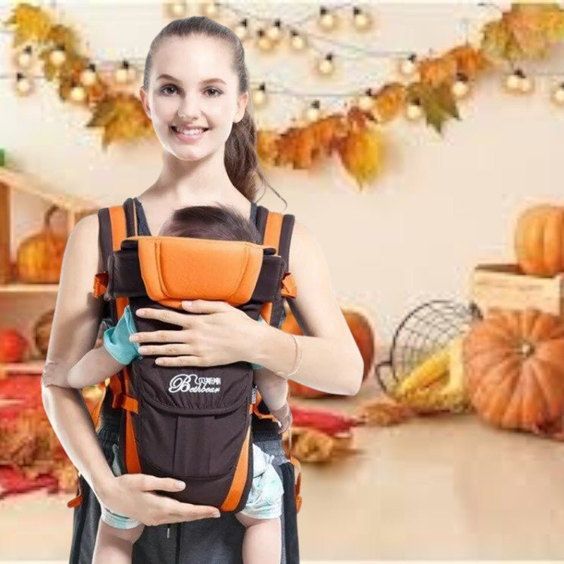 Porte bébé physiologique orange  noir au design élégant offrant maintien et style pour le portage quotidien