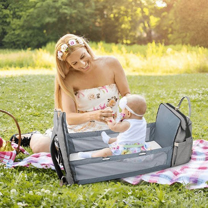 Sac à dos à langer avec lit nomade intégré pratique pour les déplacements avec bébé et les siestes en plein air