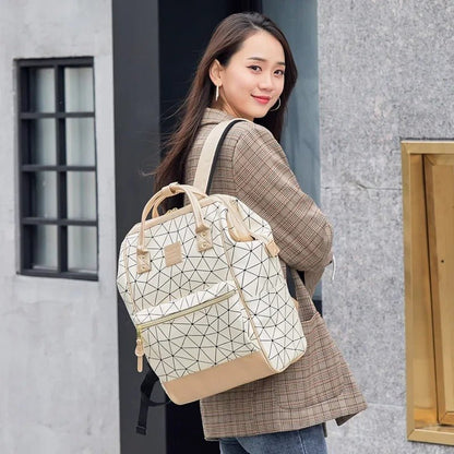 Sac à langer beige flexible et élégant idéal pour les sorties avec bébé tout en restant stylé