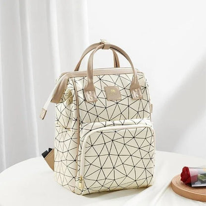 Sac à langer beige pratique et flexible parfait pour les parents en déplacement avec bébé
