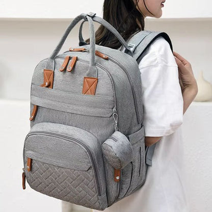Sac a langer ergonomique gris pratique et élégant pour parents modernes