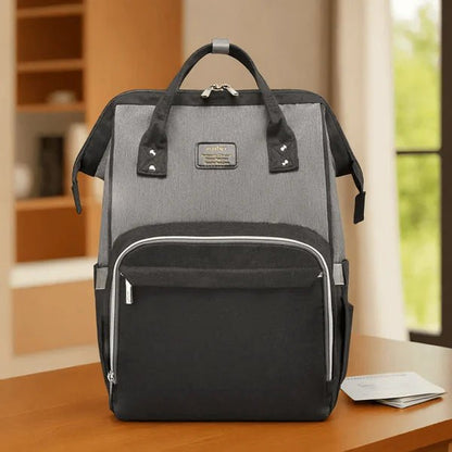 Sac a langer noir et gris ergonomique et confortable pour parents actifs