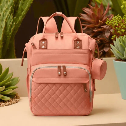 Sac a langer rose élégant et fonctionnel avec multiples poches pour parents organisés