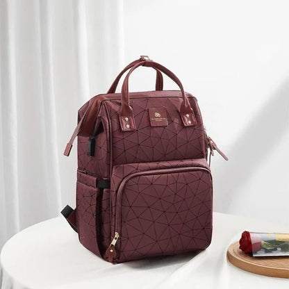 Sac à langer rouge flexible et élégant idéal pour les sorties avec bébé tout en restant stylé