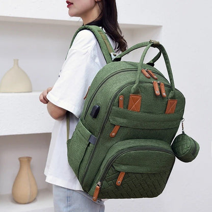 Sac à langer vert élégant et fonctionnel avec multiples poches pour parents organisés